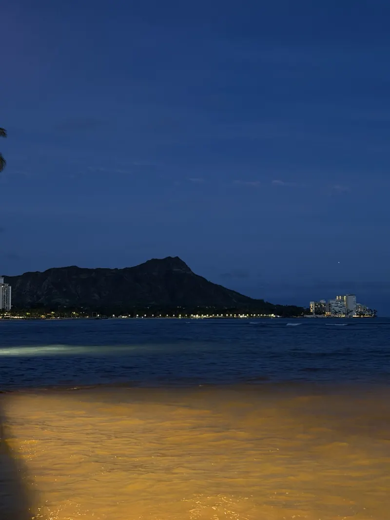 Diamond Head seen across Waikiki Beach at night